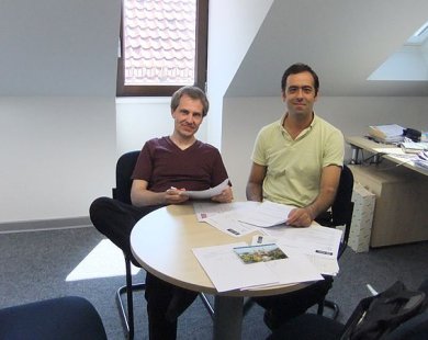 Researcher and Host sitting next to each other