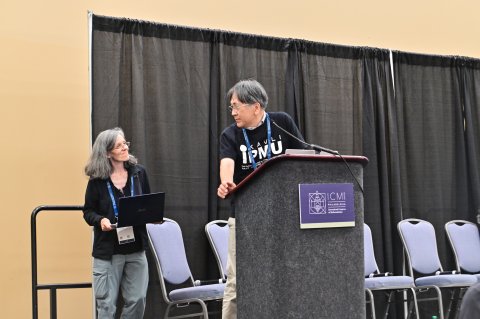 Andrea and Hiraku preparing to open the event
