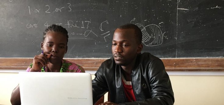 Graduate student conducting an online meeting on the laptop
